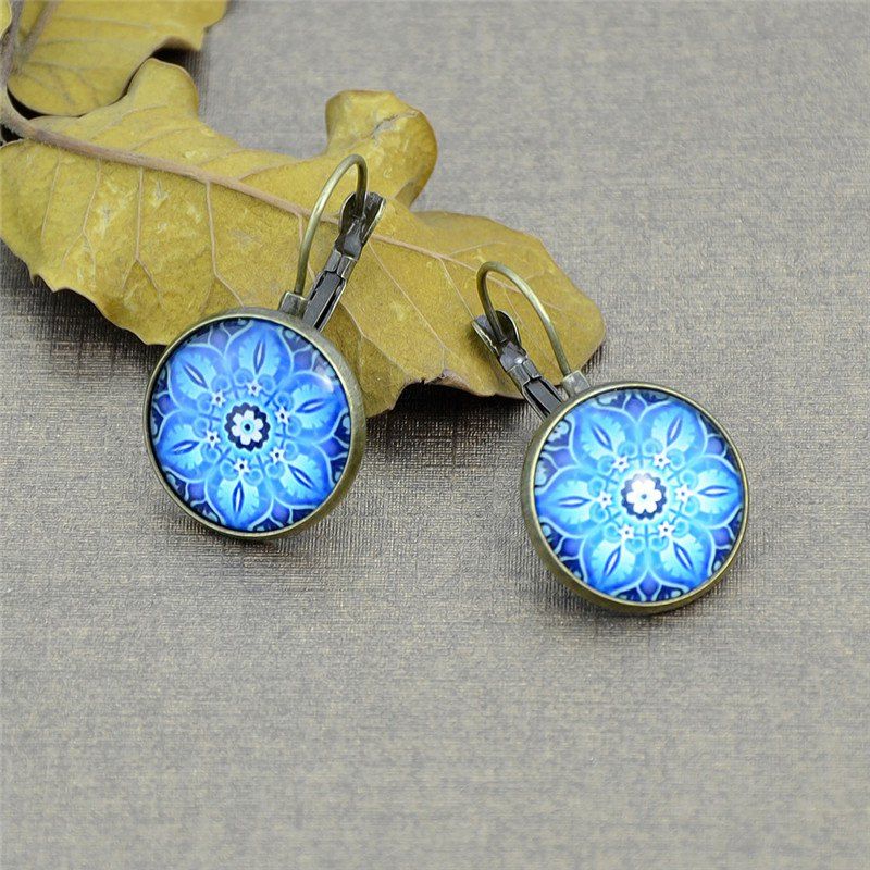 

Ethnic Flower Clip On Earrings, Golden