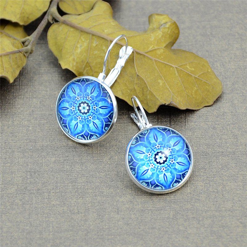 

Ethnic Flower Clip On Earrings, Silver white