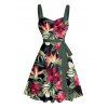 Robe de vacances à motif floral tropical et feuilles, ceinture froncée sur le buste, col en cœur, mini robe hawaïenne trapèze - Noir S | US 4