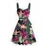 Robe de vacances à motif floral tropical et feuilles, ceinture froncée sur le buste, col en cœur, mini robe hawaïenne trapèze - Noir M | US 6