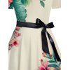 Robe de vacances à motif de fleurs et de feuilles, coupe croisée, manches courtes, col rond, coupe trapèze, décontractée - Beige S | US 4