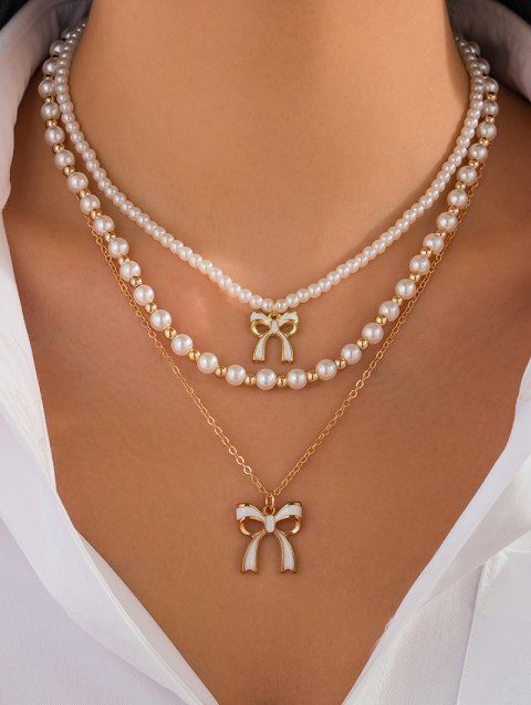 Ensemble de 3 colliers superposés avec pendentif nœud papillon et collier de perles fantaisie
