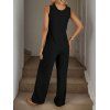 Combinaison unie avec poche avant et jambes larges boutonnées - Noir XL | US 10
