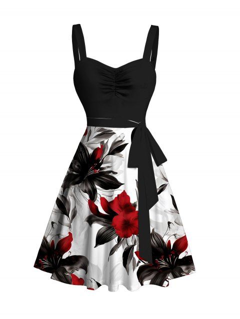 Robe de vacances printanière à motif de feuilles et de fleurs, robe à ceinture froncée et blocs de couleurs.