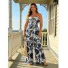 Combinaison de vacances à imprimé botanique et silhouette de feuilles, nœud papillon, épaules dénudées, jambes larges - Bleu profond M | US 6
